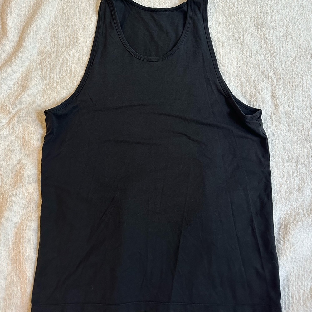 Black lululemon tank top with no tags but sizining is M/L